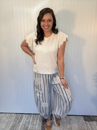 Charcoal striped linen blend balloon pants with lace patchwork details, elastic drawstring waist, and cuffed ankle hem by Mittoshop.