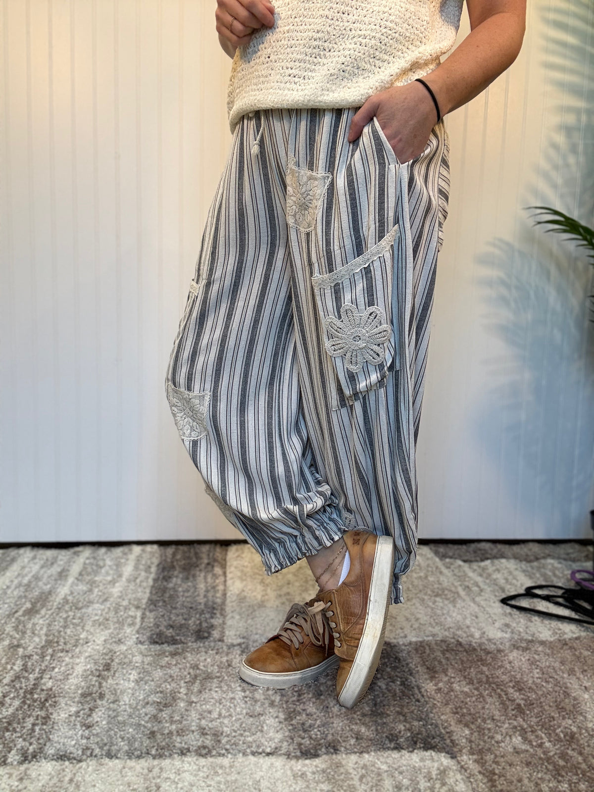 Charcoal striped linen blend balloon pants with lace patchwork details, elastic drawstring waist, and cuffed ankle hem by Mittoshop.