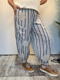 Charcoal striped linen blend balloon pants with lace patchwork details, elastic drawstring waist, and cuffed ankle hem by Mittoshop.