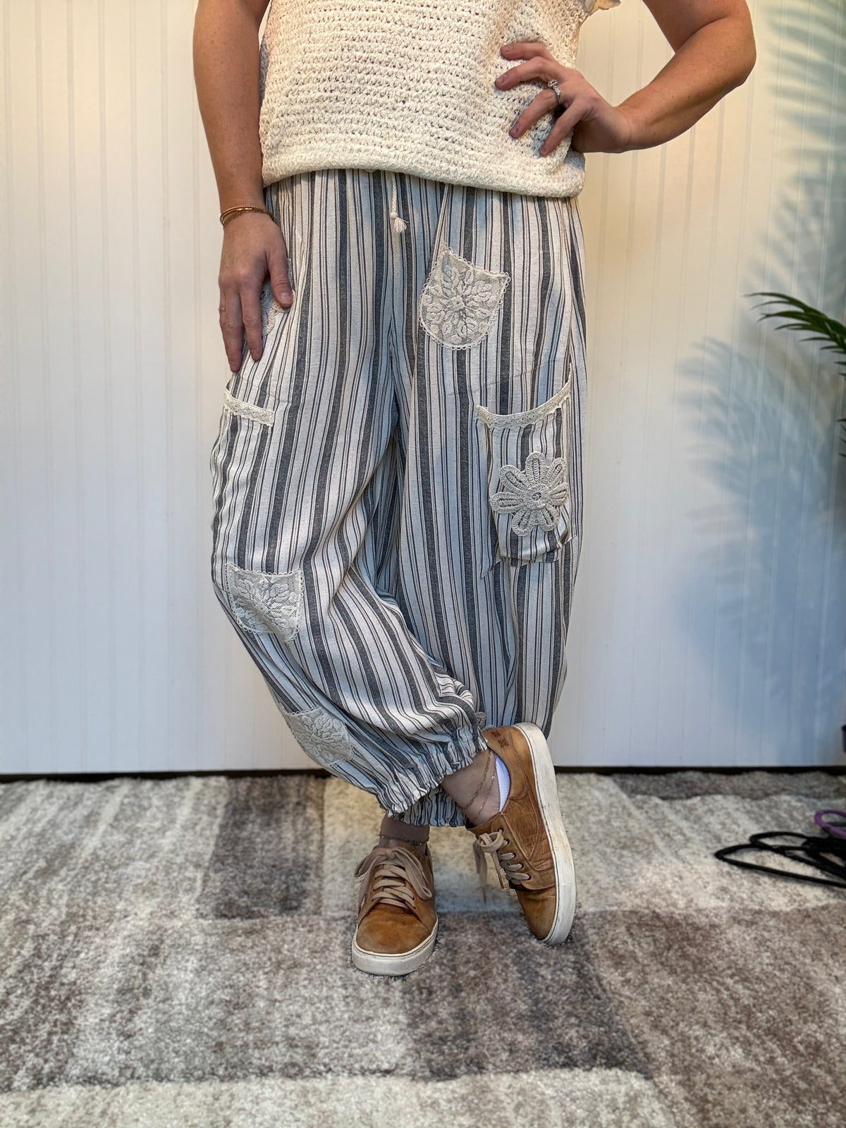 Charcoal striped linen blend balloon pants with lace patchwork details, elastic drawstring waist, and cuffed ankle hem by Mittoshop.