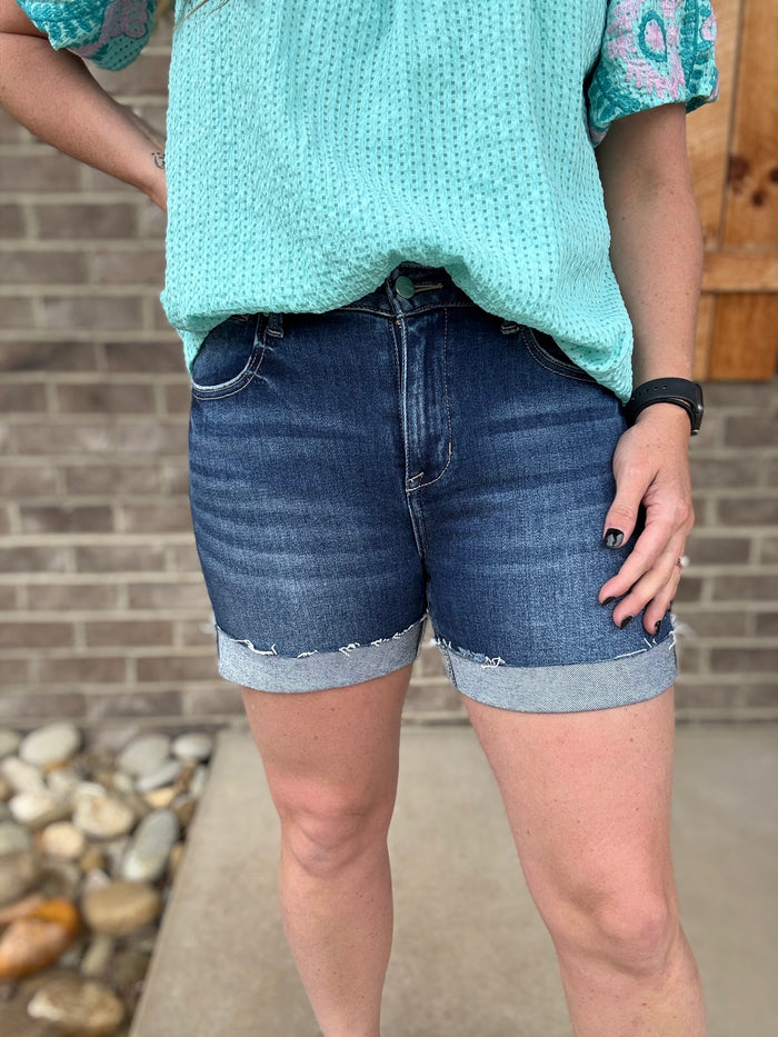 Dark Wash High Rise Raw Hem Cuffed Shorts by Risen