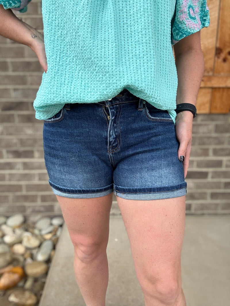 Dark Wash Mid Rise Turn Up Cuff Shorts by Risen