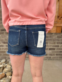 Dark Wash Tummy Control Frey Hem Shorts by Risen Jeans