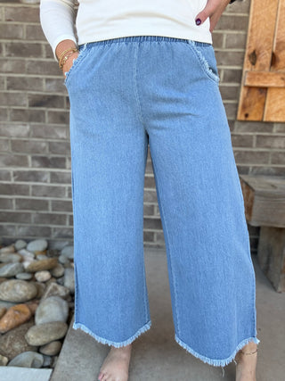 Light Wash Washed Denim Pants with Fringe Hem by Umgee