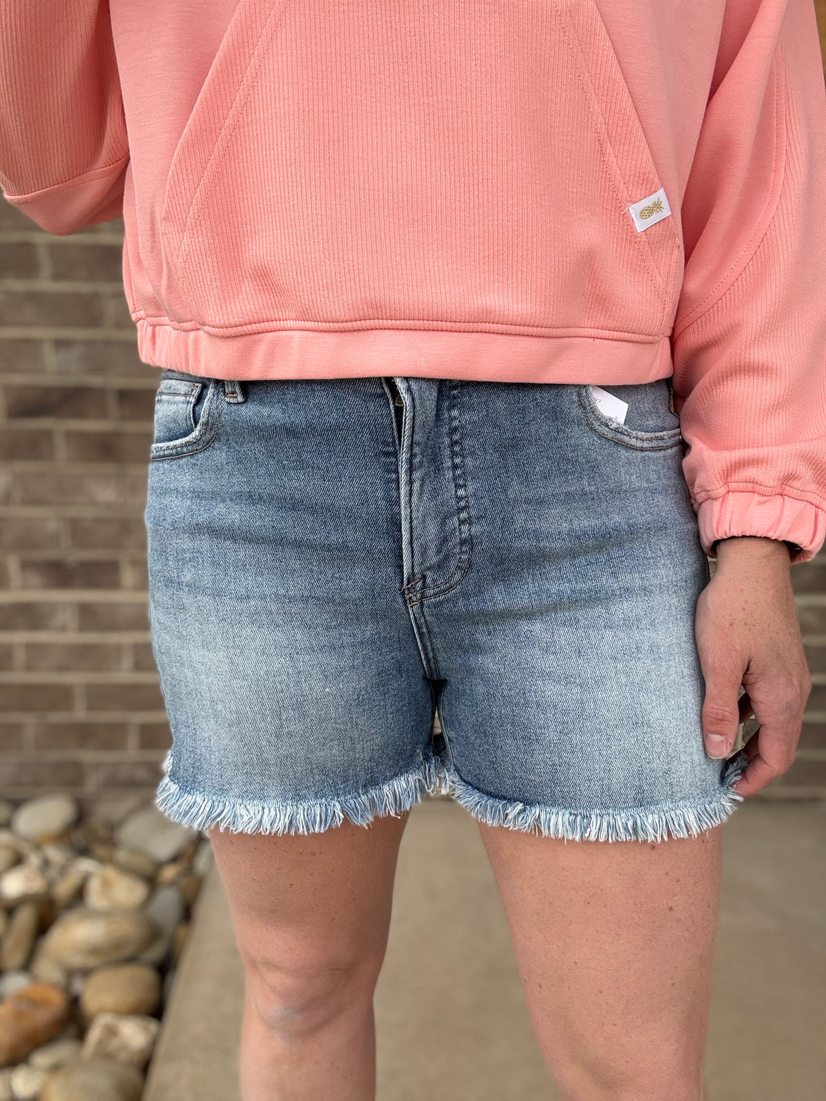 Medium Wash Tummy Control High Rise Frey Hem Shorts by Risen Jeans