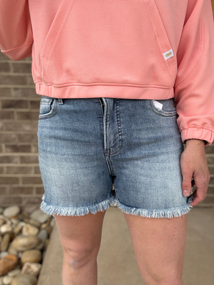 Medium Wash Tummy Control High Rise Frey Hem Shorts by Risen Jeans