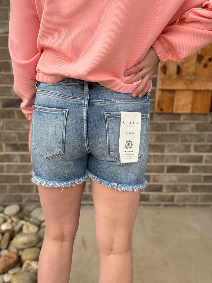 Medium Wash Tummy Control High Rise Frey Hem Shorts by Risen Jeans