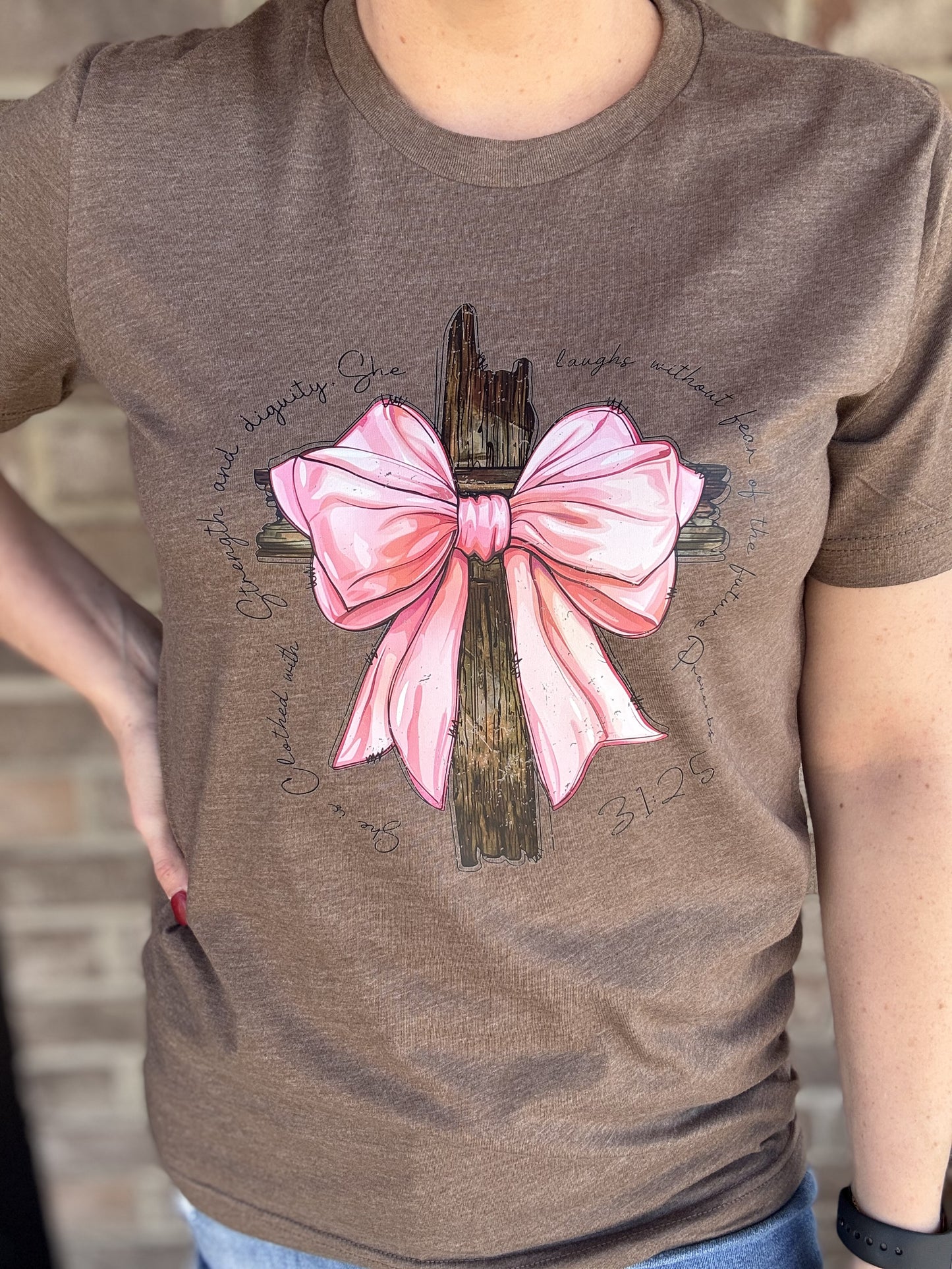 8506- She is Clothed with Strength & Dignity Cross w/ Bow Short Sleeve Graphic Tee