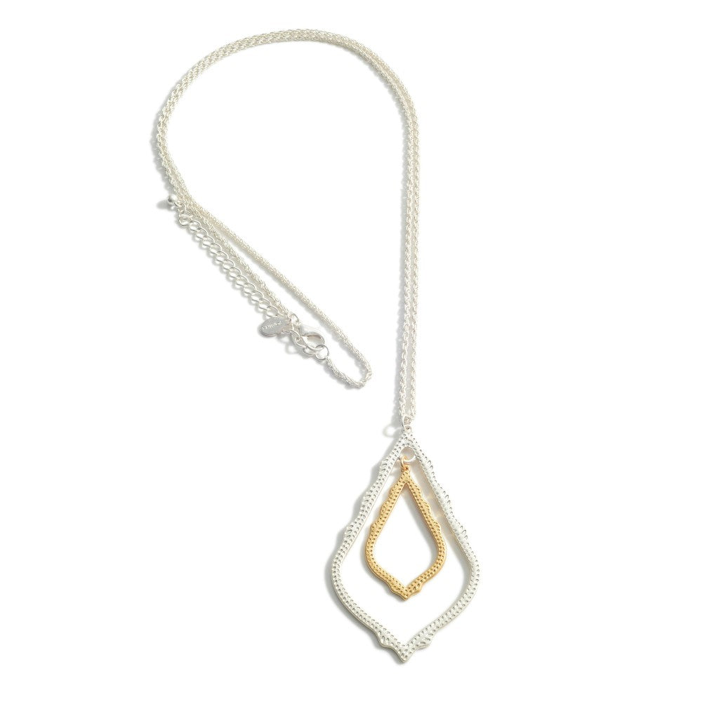 1482- Gold & SIlver Long Chain Necklace Featuring Metal Pendant.