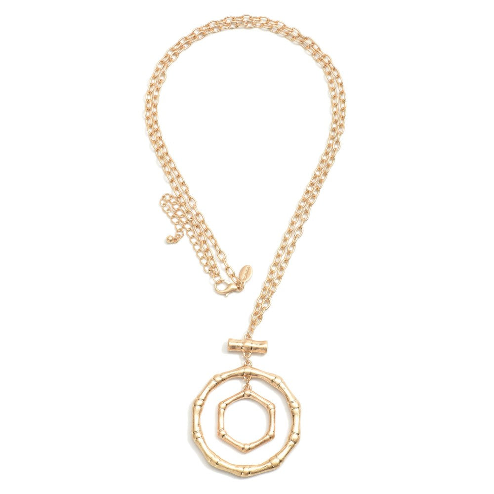 1695- Gold Long Metal Tone Necklace Featuring Bamboo Rings