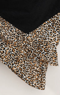 900- Umgee Black Top with Animal Print Base Detail